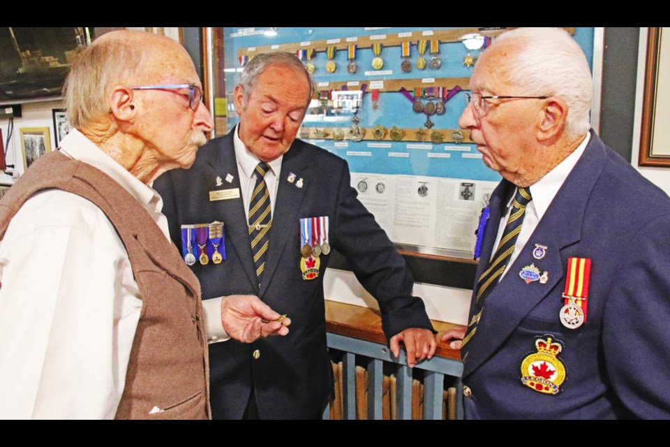 Murray McGillivray asked about some military medals as he chatted with Brian Glass and Bill Ruckaber of the Weyburn Legion, during a meet-and-greet held there last year.