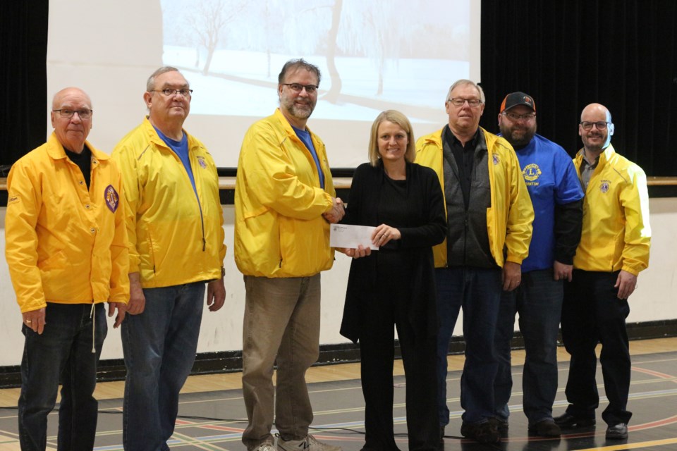 The Yorkton Lions presented a $ 2,500 cheque to Dr. Brass School Nov. 28.  The funds will go towards the school's breakfast program, which the Yorkton Lions have supported for nearly two decades.  From left to right, Lions Allan Konkin, Don Reed, Denny Vachon, Dr. Brass Vice Principal Chantal Kitchen, Dave Blommaert, Mike Schneider and John Bauman.