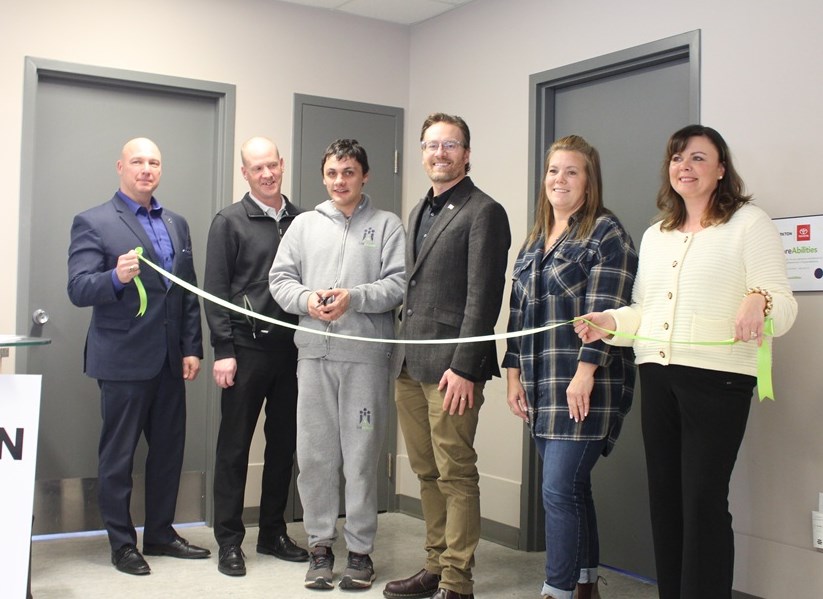 A ribbon cutting for the event was held, featuring dignitaries, participants, and SaskAbilities workers.