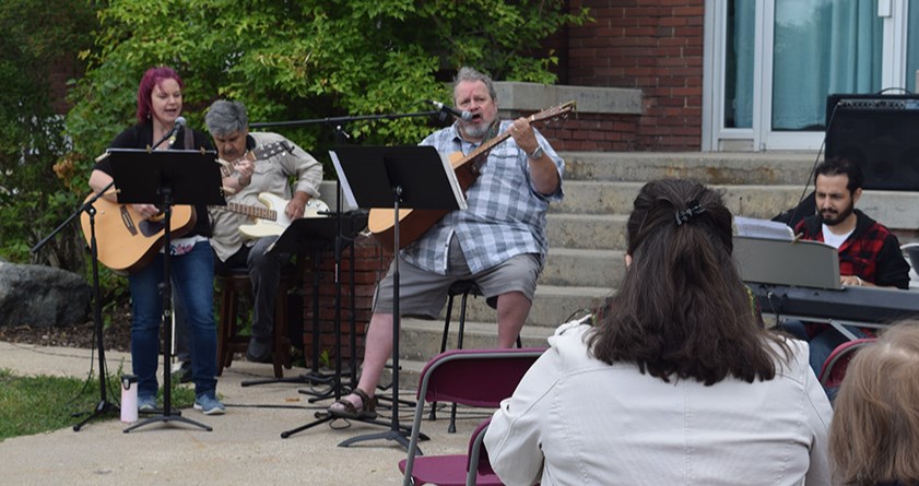 Providing the music and leading the singing outside the Town of Canora office at the Interdenominational Church Service on July 16, from left, were: Cheri Kuhn (vocals and guitar), Abraham Martin (bass), Brett Watson (vocals and guitar) and Caleb Senechal (keyboards).