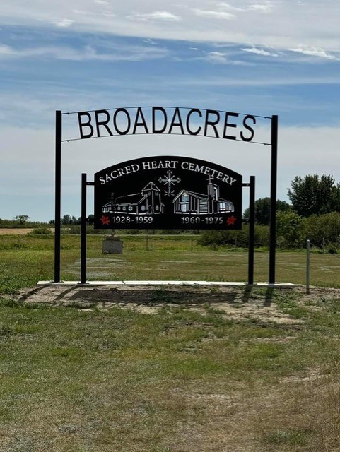 A new sign at the cemetery was designed by Fred and Shane Connery Volk, remembering both of the Sacred Heart Catholic Churches.