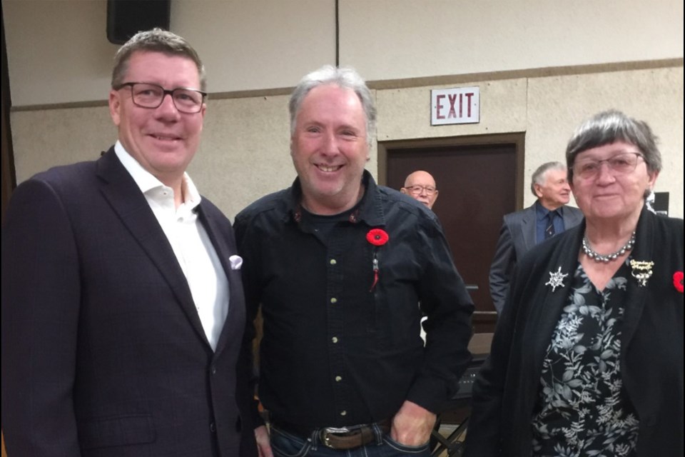 Premier Scott Moe, Reeve Gary Nickel and Lorraine Olinyk at the Borden and District Lions Club Remembrance Day service in the Borden Community Centre on Nov. 11.