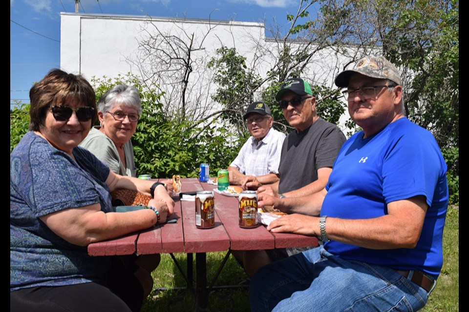 Among those first in line to have a burger and a beverage at the Crossroads Credit Union member appreciation barbecue in Canora on June 22, from left, were: Cynthia Gazdewich, Marlene Kozak, Peter Ostafichuk, Ernie Kozak and Ernie Gazdewich. Crossroads also held barbecues in Preeceville, Sturgis and Wadena. 