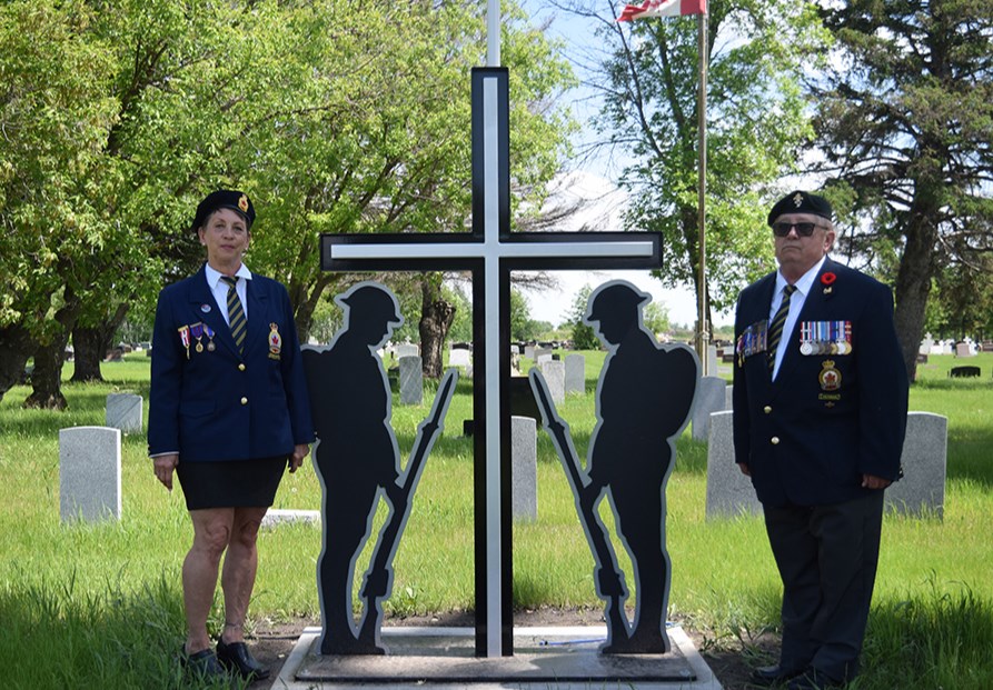 Flanked by Deb Gabora, first vice-president of the Canora branch of the Royal Canadian Legion, and Chris Sokoloski, Canora Legion President, the new veterans’ monument was dedicated during the Decoration Day service at the Canora Cemetery on June 4.