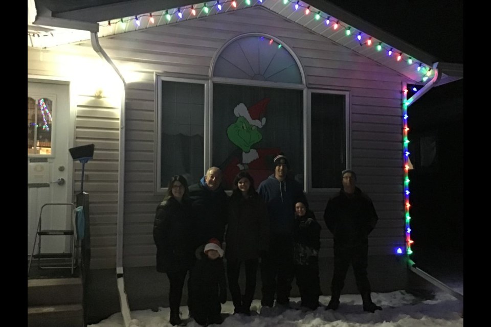 The Canora Group Home received a special gift on the evening of December 14, new Christmas lights. The lights were donated by: Mayor Mike Kwas, Jessica Kwas, СƵ Terry Dennis, Lori Dennis, Deryl Ortynsky, Joan Kowalyshyn, Kelly McTavish and Jodie Kowalyshyn. In the photo, from left, were: (back row) Joan Kowalyshyn, СƵ Terry Dennis, Jessica Kwas and Mayor Mike Kwas, and Lionel, Group Home resident. Also in the photo were Van Kwas and his younger brother Monty, sons of Jessica and Mike. / Canora Group Home