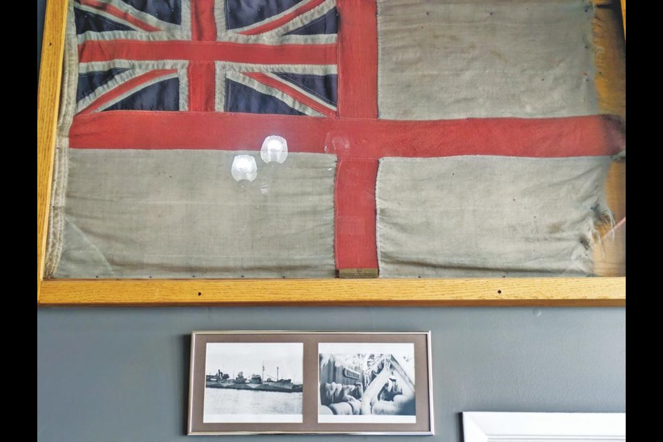 This is the flag flown on HMCS Weyburn, on display at the Weyburn Legion Hall, along with two photos of the corvette.