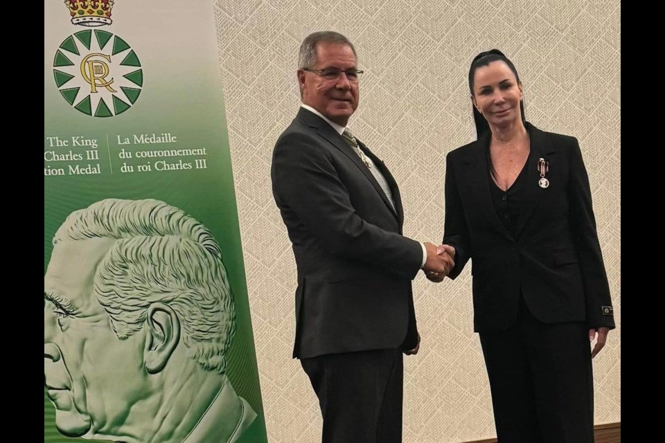 Brenda Cheveldayoff, right, after receiving her King Charles III Coronation Medal from Lt. Gov. Russ Mirasty.