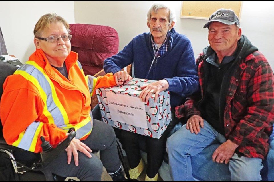 Teresa and Fred Sandeski were presented with this box of donations, collected at a recent fundraiser event for them, by event organizer Johnny Knox on Wednesday afternoon.