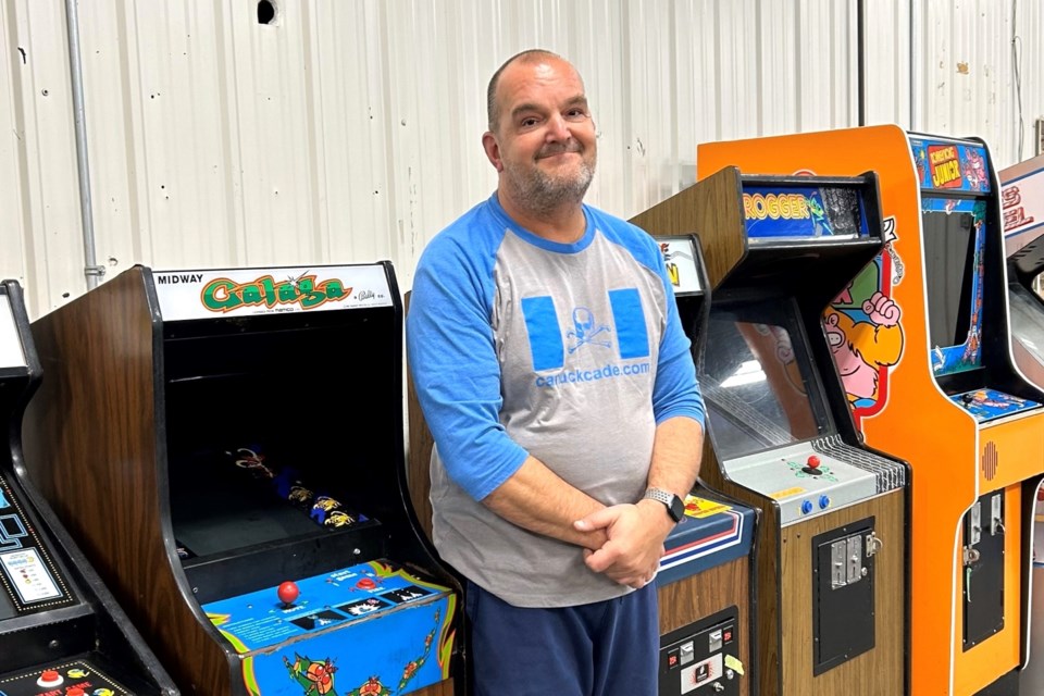 Kevin Mortenson stands among the machines at his Canuckcade business. 