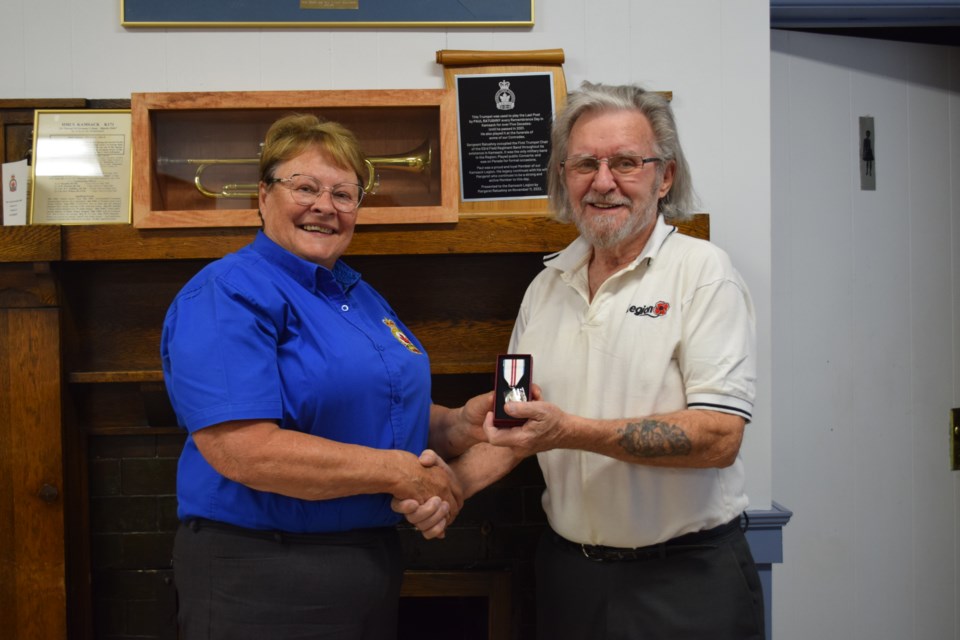 From left, Carol Pederson, provincial president of the Saskatchewan Command of the Royal Canadian Legion, presented Jim Woodward with the Queen Elizabeth II Platinum Jubilee Medal.