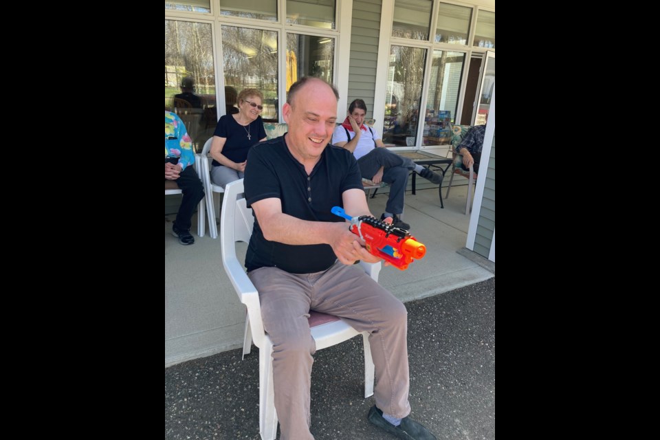 Prairie Branches client Cory Ruberry was focused and ready for his turn at target shooting during the Western Day activity shared between Parkview Place and Prairie Branches residents.