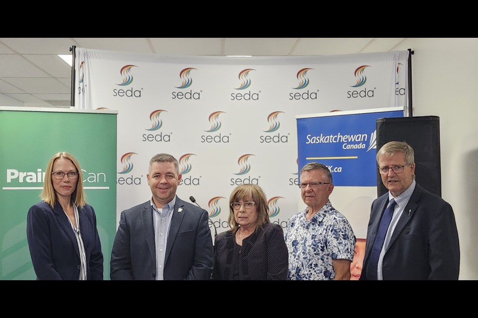 SEDA CEO Verona Thibault, centre, joins federal and local officials for a group photo after the funding announcement on Tuesday, Sept. 10.