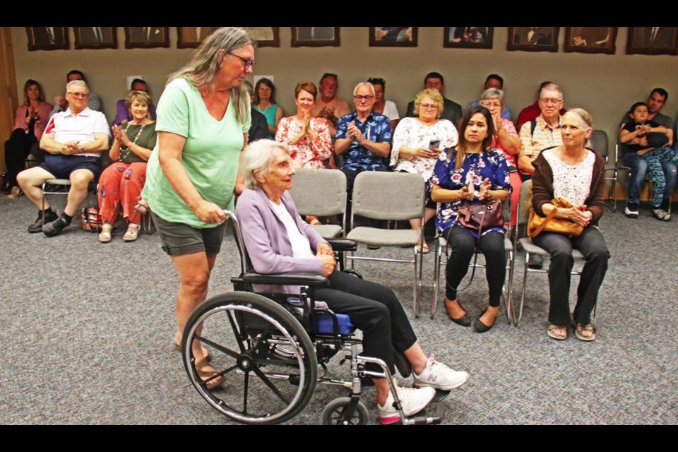 Arvilla Carleton was wheeled over as the first recipient of one of the Queen Elizabeth Platinum Jubilee Medals on Monday evening.