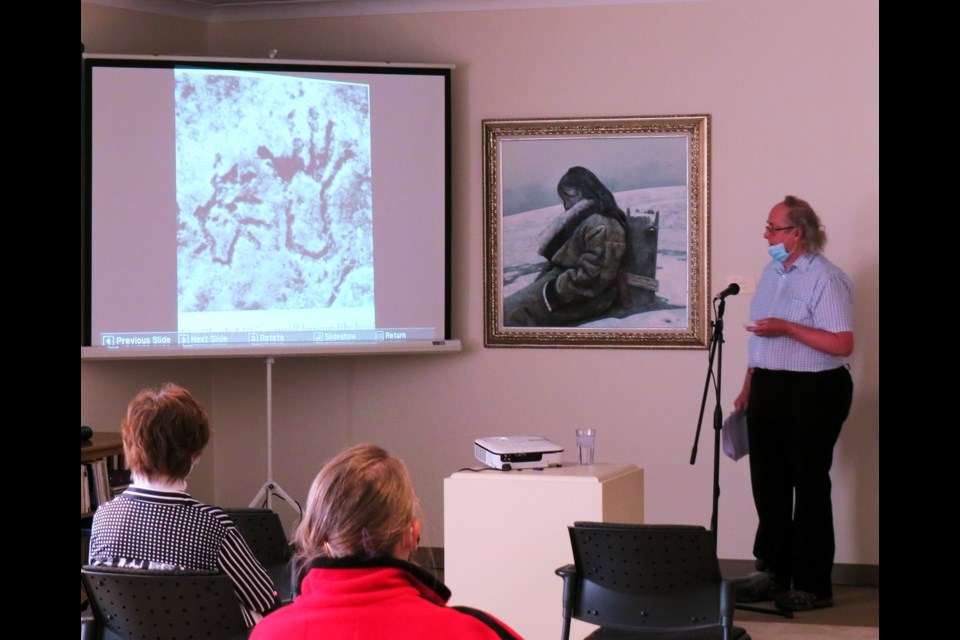 David Munro, at left, from the “Friends of St. Victor Petroglyphs”, interpreted ancient aboriginal images carved is stone, during the Speaking of Art program at the Shurniak Art Gallery.