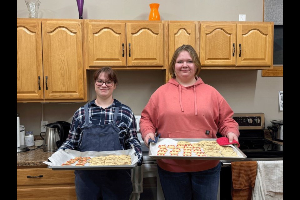 Ella-Renn Slater, left, and Cheyenne Lake are rangers with the Stoughton Girl Guides and are always offering help to the younger group. 