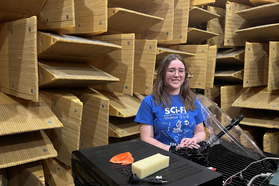 Clara Lightheart, SCI-FI camp instructor and engineering physics student, toured high school students through the anechoic chamber in the College of Engineering. 