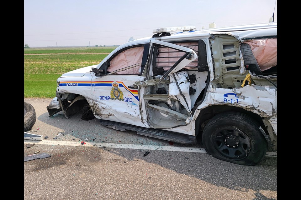 The officer was standing at the drivers side door of the vehicle he had pulled over when the collision occurred.