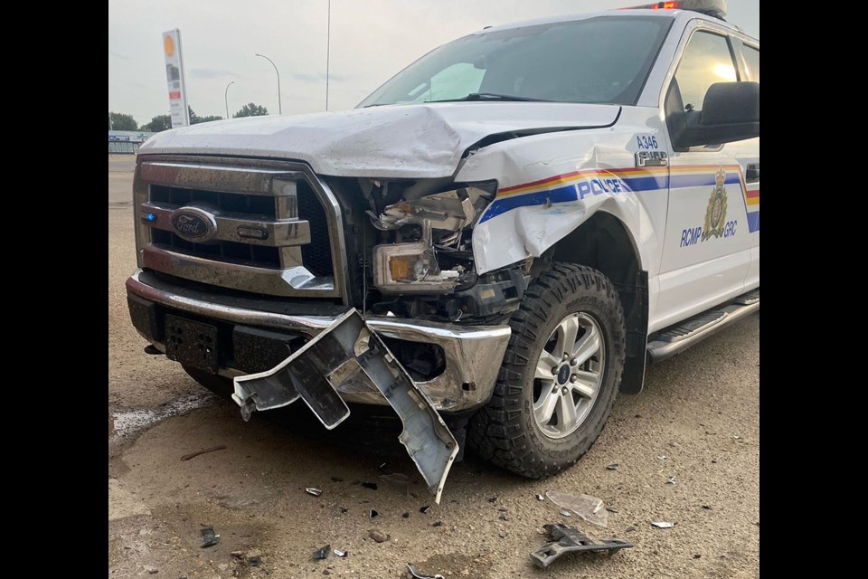 When officers attempted to block a suspect vehicle in, the truck rammed two police vehicles.