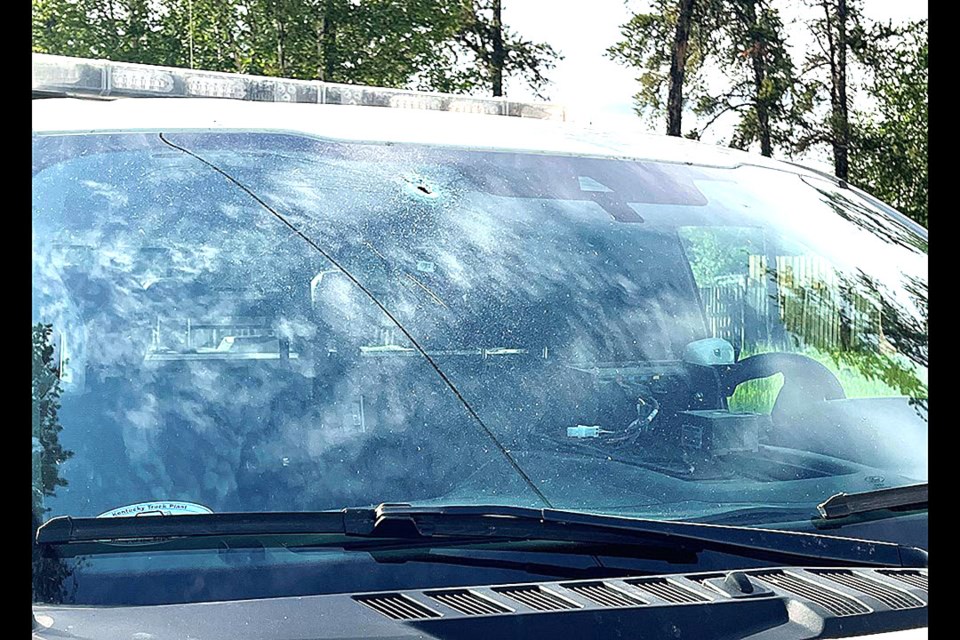 A man got out of the car with a firearm and started shooting at an officer standing by a police truck. Bullets struck the windshield and the police vehicle’s radiator. 