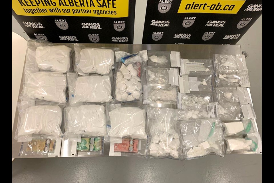 Officers found 1,100 grams of suspected cocaine, 123 grams of methamphetamine, 7,500 grams of suspected phenacetin, and 25 grams of psilocybin, $9,080 cash.