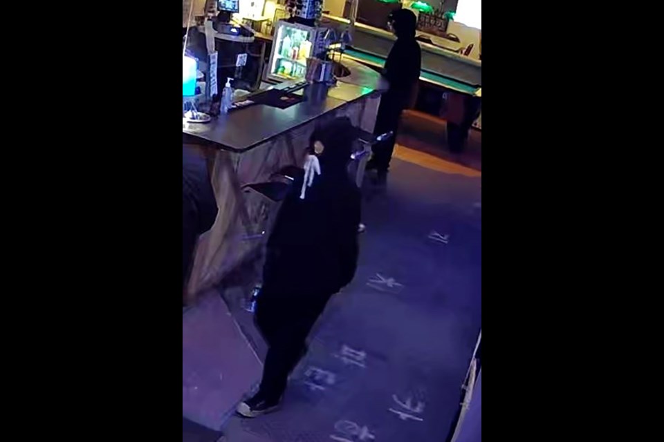 Three individuals, one female and two males, entered the business. The suspects threatened and assaulted two employees of the business with a knife and hatchet. 