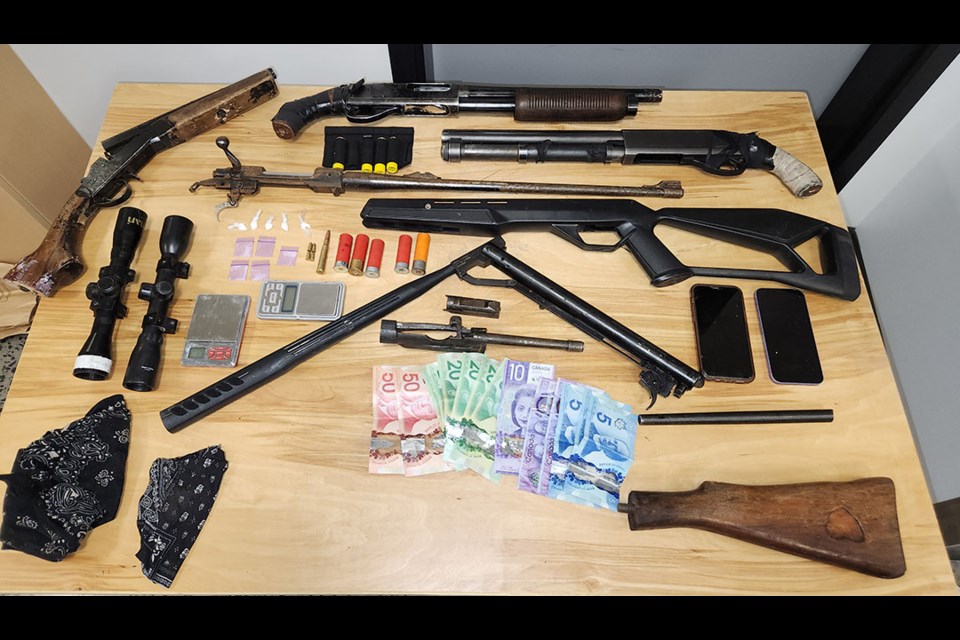 During the search, police seized about 2.5 grams of cocaine and a gram of methamphetamine, both divided up into small packages, as well as an air soft rifle, a shotgun, two sawed-off shotguns, a rifle, ammunition and drug trafficking paraphernalia.