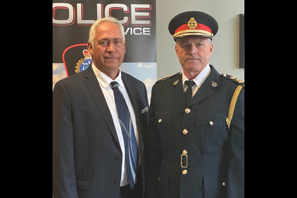 Mayor Marcel Roy stands with Brent VanDeSype, who was sworn in as the new Police Chief of Weyburn.