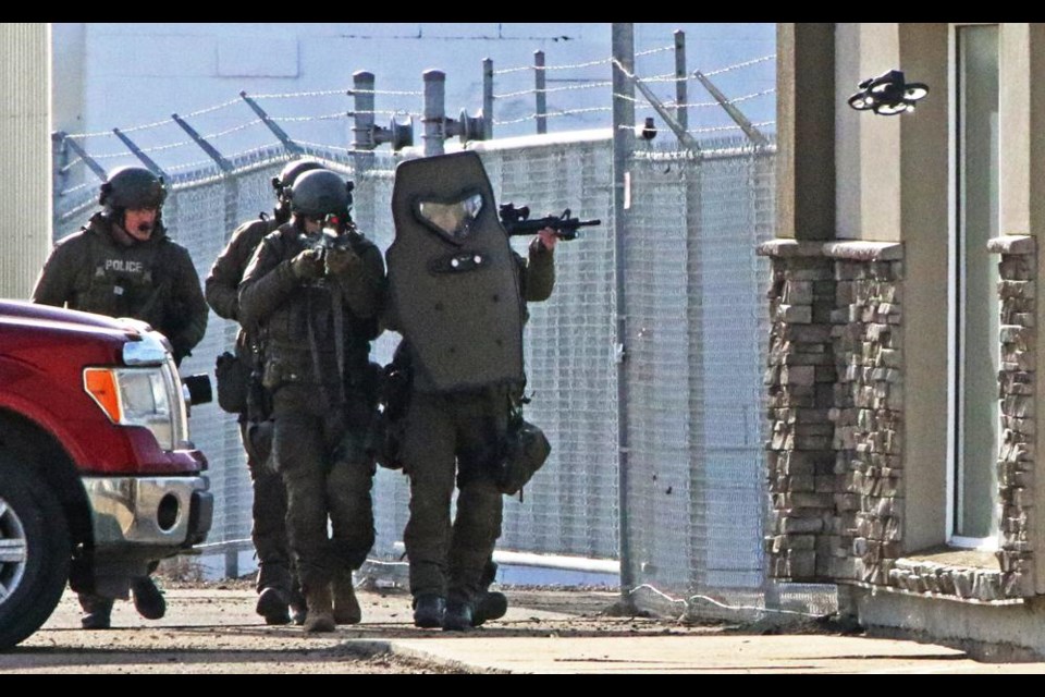 The Joint Tactical Support Team for the Weyburn and Estevan police services approached a building in a training exercise on Friday morning.