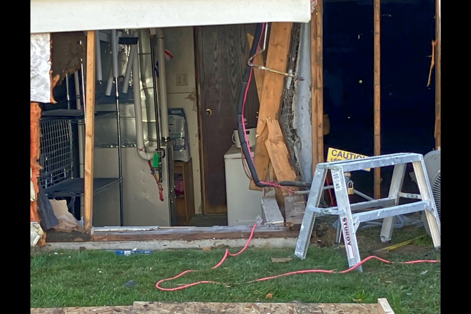 Impact from the vehicle damaged a wall to the furnace room of  the condo unit.