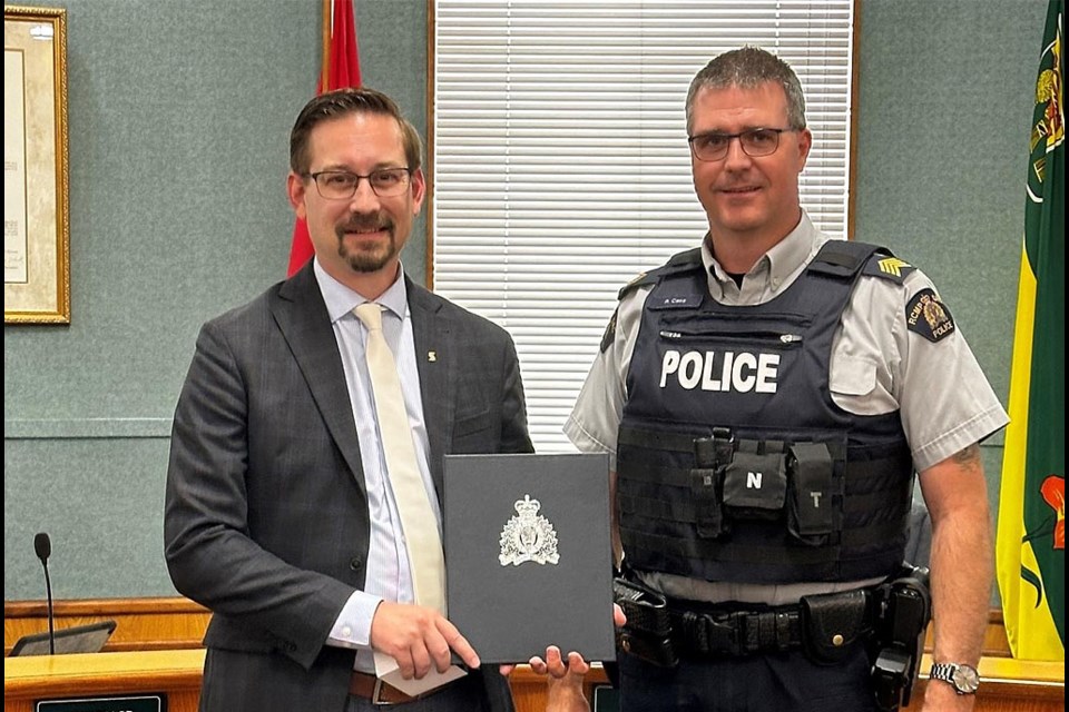 RCMP S/Sgt Ryan Case presented Shawn Russin with a Certificate of Appreciation.