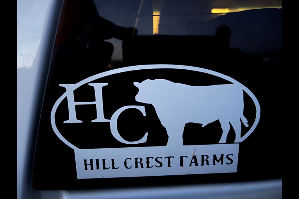 A stolen truck has a white “Hill Crest Farms” sticker in a window and a black fuel tank in the box.