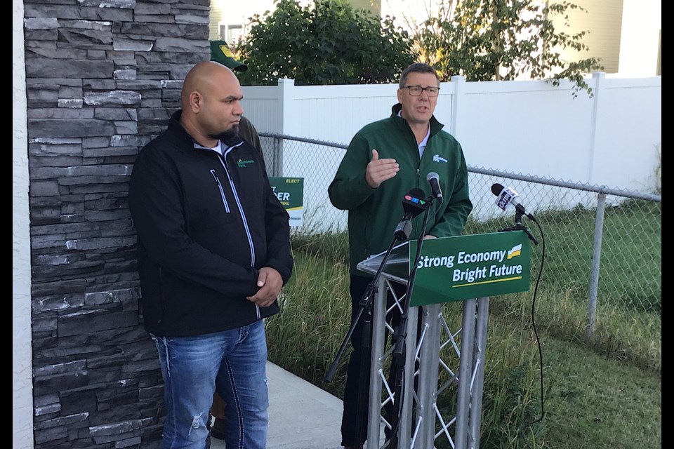 Scott Moe, along with Regina Mount Royal Sask Party candidate Jaspreet Mander, speaks at a campaign announcement in Regina. 