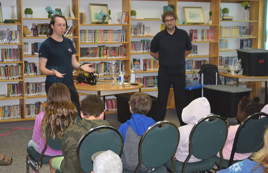 Many curious youngsters came out to see the energetic and educational presentation by Evan Tichborne (left) and Jerome Schmeiser of the Saskatchewan Science Centre's Go! Code and GenAction team at the Canora Parkland Library on July 18.