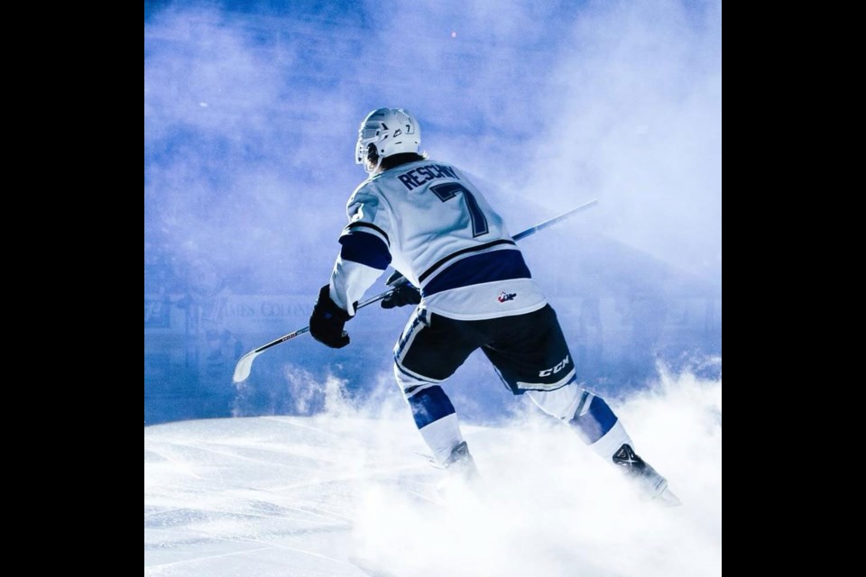 Cole Reschny of Macklin enters the ice before playing a game with the Victoria Royals WHL team.
