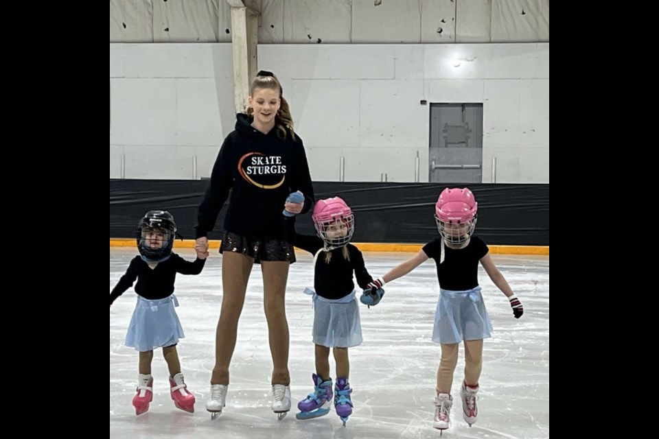 Beginner skaters from left, were: Charlotte Prokopetz, Layla Jaeb (coach), Emily Prokopetz and Harper Flowers.