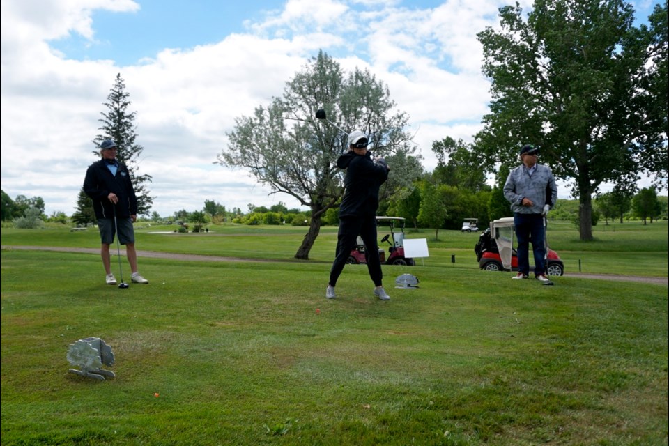 Lorie-Gay Drewitz-Gallaway teed off while blindfolded during the Estevan Lions Club's golf tournament in support of the CNIB. 