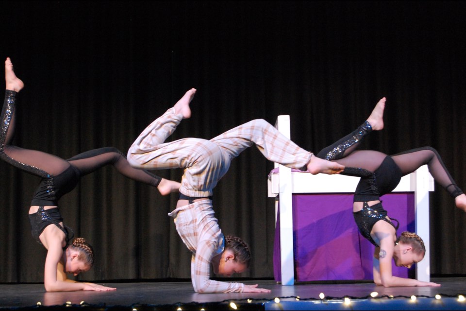 Natalie Bertoia, Kailey Bertoia and Keira Schumack defy gravity during their acro performance of Bad Dream.