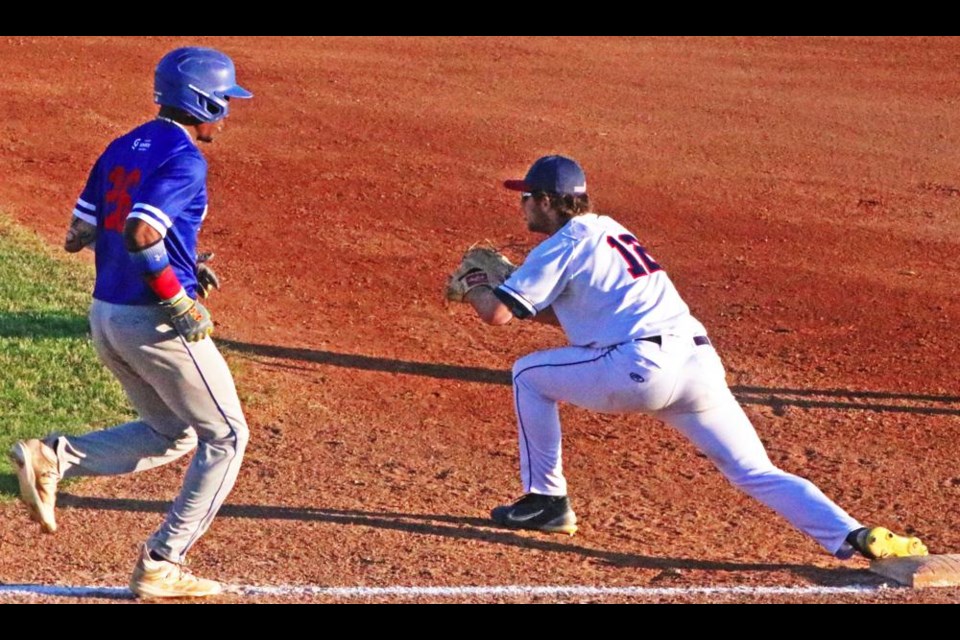 Weyburn Beavers player River Smith caught the throw to put out the batter for the Brooks Bombers on Saturday evening.