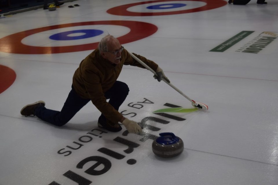 Don Probe kept his eyes on the target as he released this rock during the Canora Town & Country Bonspiel, held from January 26 to 29. / Rocky Neufeld