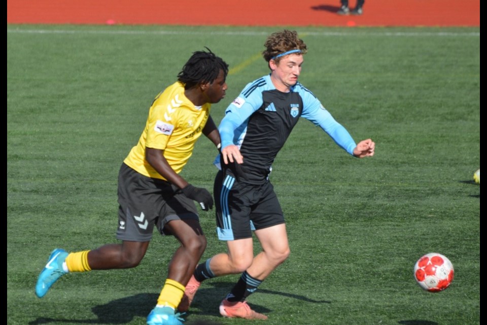 Saskatoon Alliance and Fredericton DSA players chase the ball in their U17 game in Sydney, Nova Scotia.