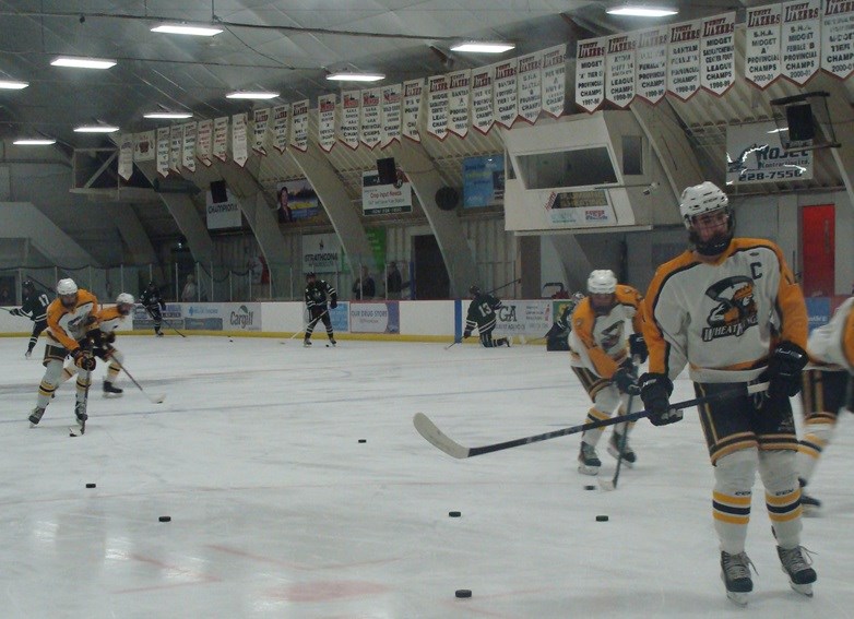 Wheat King Captain, Chase Weinkauf of Macklin, leads his team in warm ups before playing against the North East Wolfpack in Unity.                               