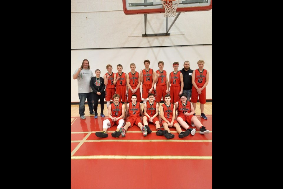 The Canora Composite School Cougars senior boys basketball team hosted and won the conference basketball tournament on March 11-12. From left, were: (back row) assistant coaches Andrew Hoffman and Kamdyn Creedon, Logan Lewchuk, Cole Marcinkoski, Joey Palagian, Matthew Makowsky, Everett Paley, Rylan Bletsky, head coach Noah Creedon, and Nate Wolos; and (front) Brendon Landstad, Dawson Zuravloff, Hudson Bailey, Jackson Krotenko and Josh Rock.