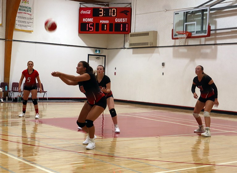 Ava Love of the CCS Cougars senior girls volleyball team dug out a spike in the match against the visitors from Kamsack on Sept. 11. Teammates providing support for Love, from left, were: Katherine Hauber, Paisley Wolkowski and Miah Ruf.