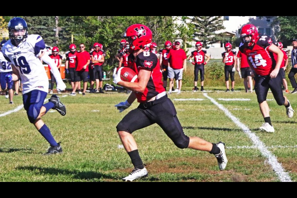 Weyburn Comp running back Haydin Buehler took off down the field for a first down-plus during the Eagles' exhibition game vs North Battleford on Friday afternoon.