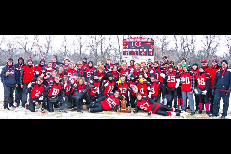 The Weyburn Comp Eagles players and staff gathered under the scoreboard after winning the 鶹Ƶ Rural Football League title for the third year in a row on Saturday, defeating Moose Jaw Central 28-8.