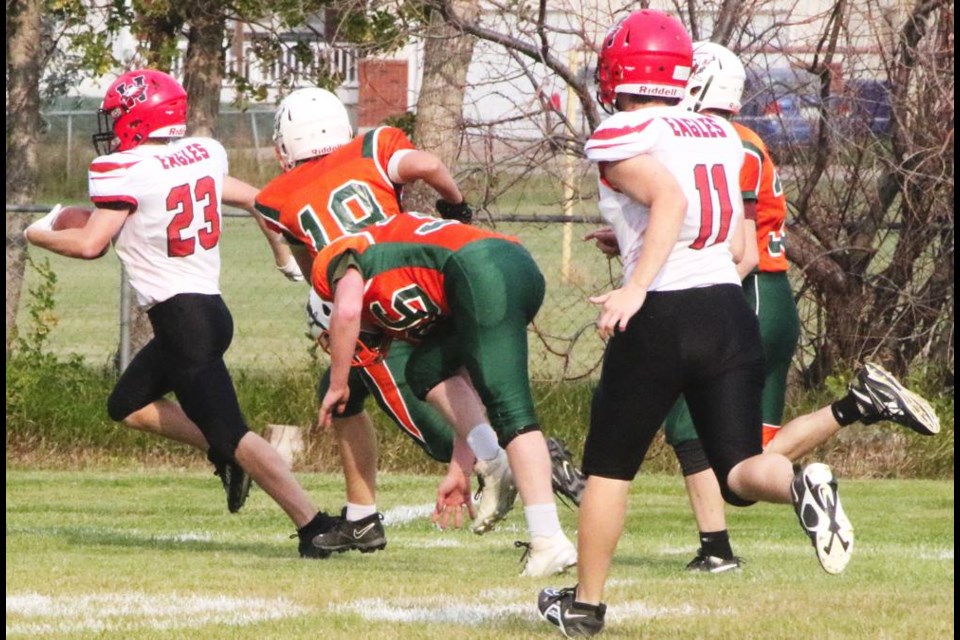 Comp Eagles player Max Vennard ran for a touchdown, during a controlled scrimmage on Wednesday with the junior varsity teams; Weyburn was playing against Moose Jaw Peacock in these photos.