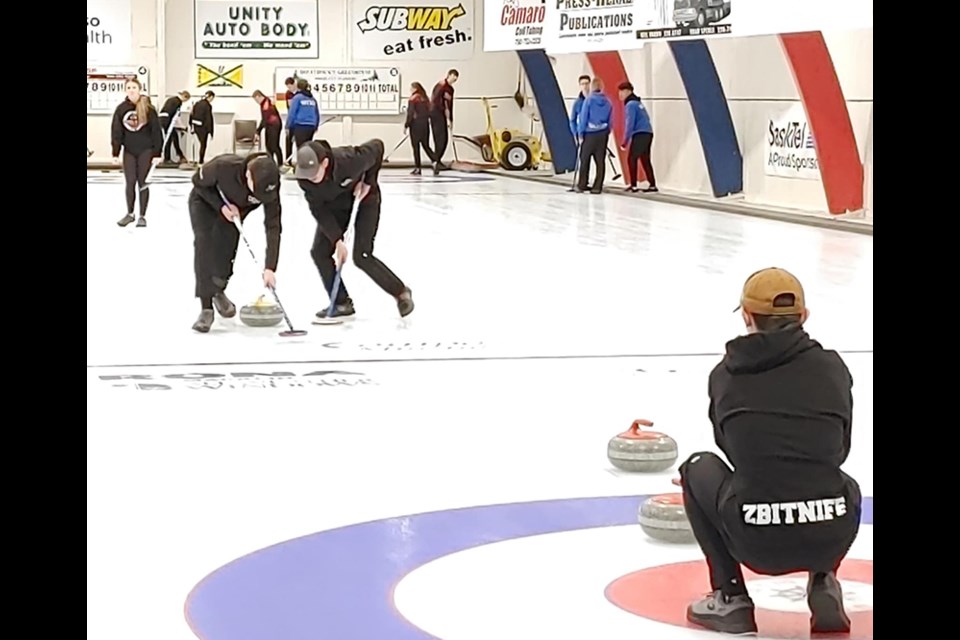 Canora’s mixed curling team came home with bronze medals after competing in the SHSAA Provincial Curling Championships in Unity. From left, after releasing her rock, Paisley Wolkowski gave encouragement to sweepers Joshua Prychak and Owen Ostafie while Jordan Zbitniff called the line from the house. 