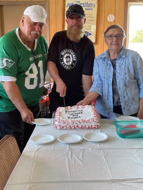 During the Kamsack Powerhouse Museum’s celebration for the 1946-47 Kamsack Cyclones baseball team held on Aug. 25th, Cameron Laevens, center, son of former Kamsack Royals coach Octaaf Laevens, came from Alberta to cut the cake at the event. To Laeven’s left was former Kamsack Royals player Roy Derworez, and to his right was Powerhouse Museum president Lydia Cherkas.