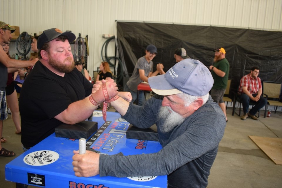 Brandon Olafson, left, challenged [Crazy] George Iszakouits during the Estevan open house.

