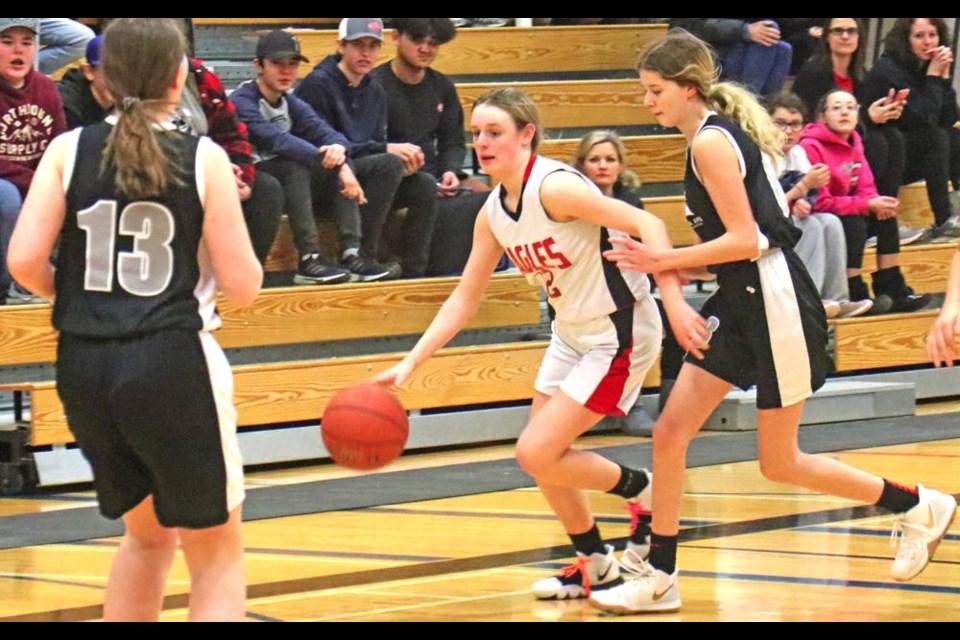 WCS Eagles player Tamberly Kreger came up the court with the ball towards the Rocanville basket